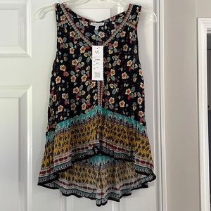 Summer top shorter front that drapes in the back